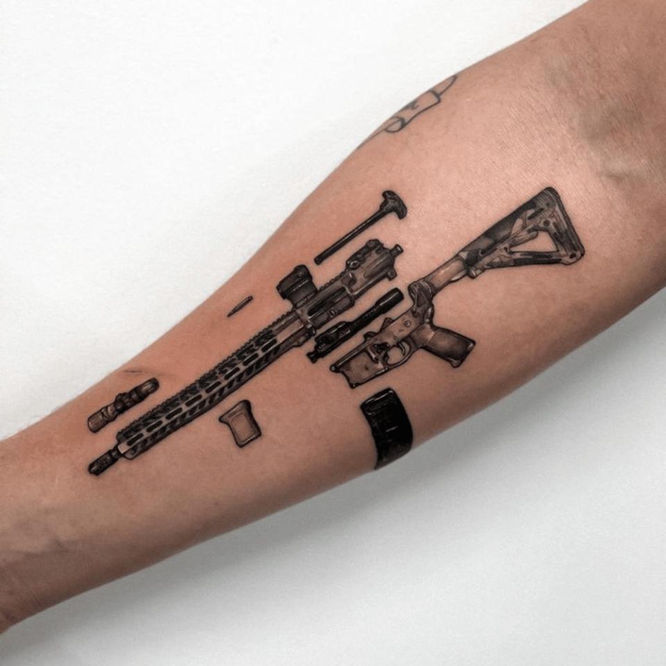 Tattoo uploaded by JenTheRipper  Submachine gun tattoo by Victor Zabuga  VictorZabuga minimalistic blackwork conceptual gun  Tattoodo
