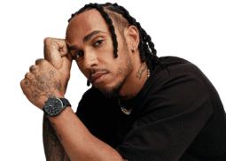 Braided individual wears IWC watch, gazes intensely.