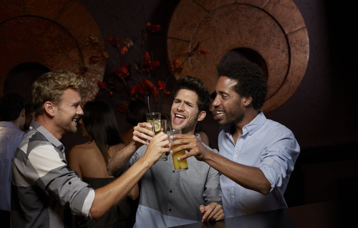 Men 'cheersing' over beers. 
