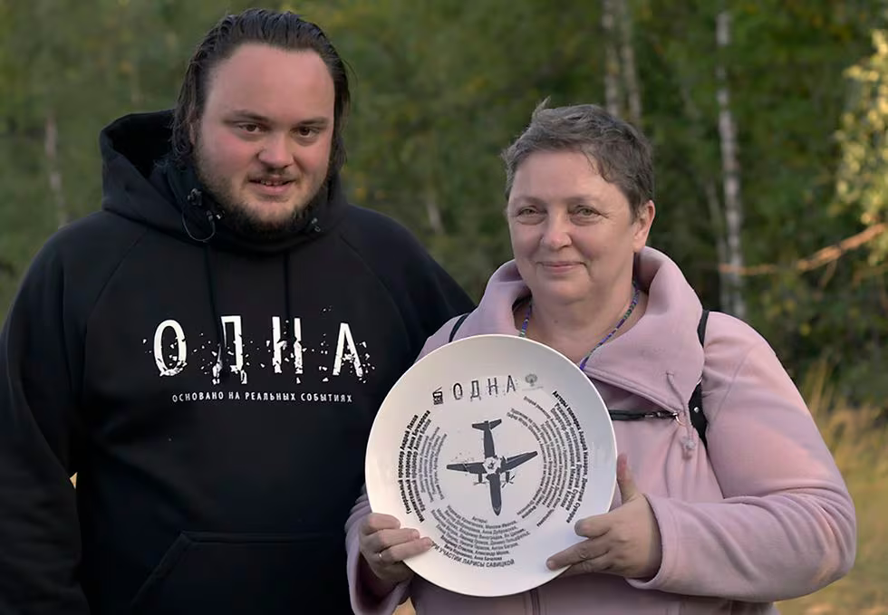 Larisa Savitskaya posing with the director of the documentary about her crash. 