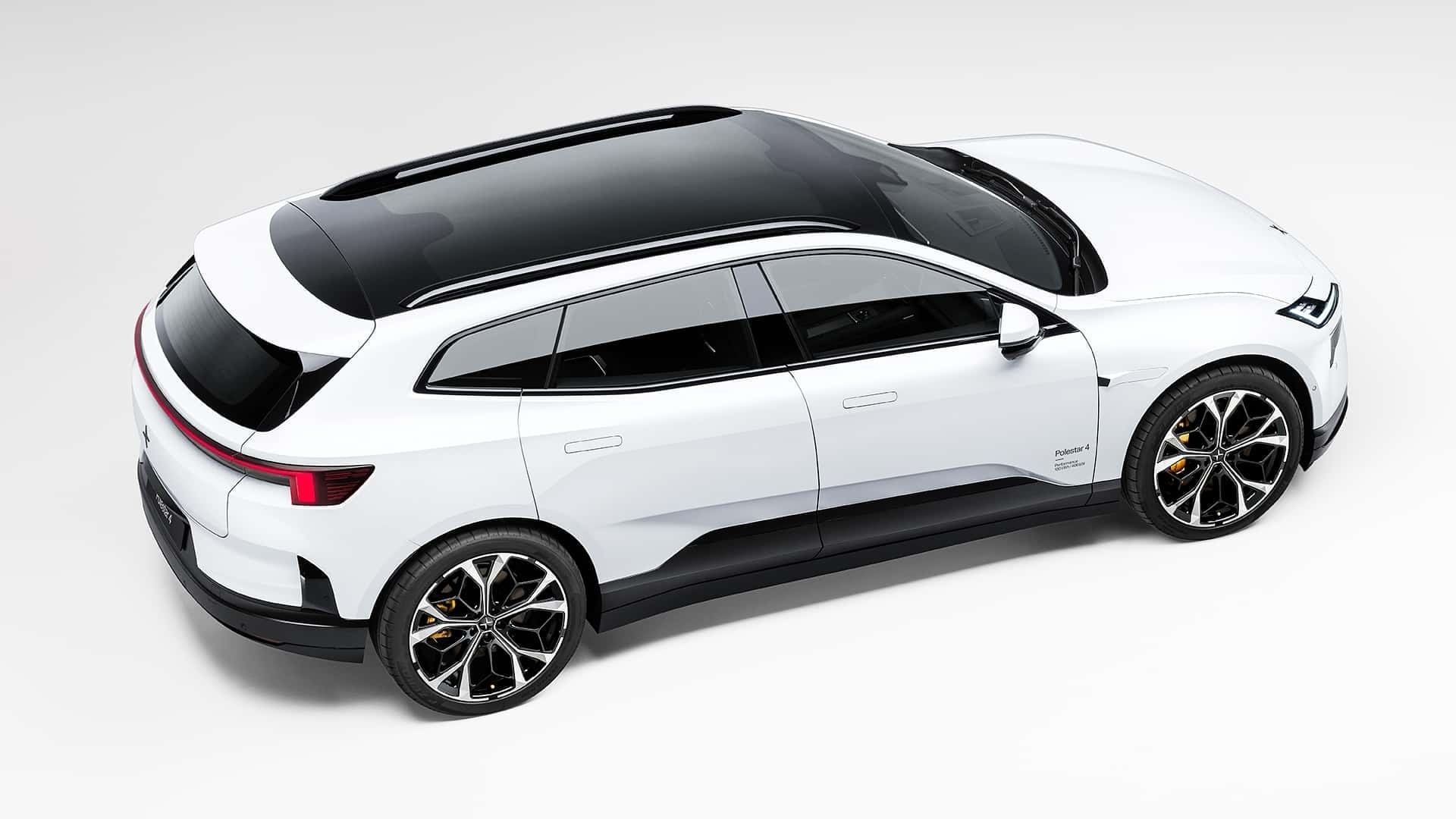 Overhead three-quarter view of the 2027 Polestar 4 SUV showing its wagon-like roofline and panoramic glass roof